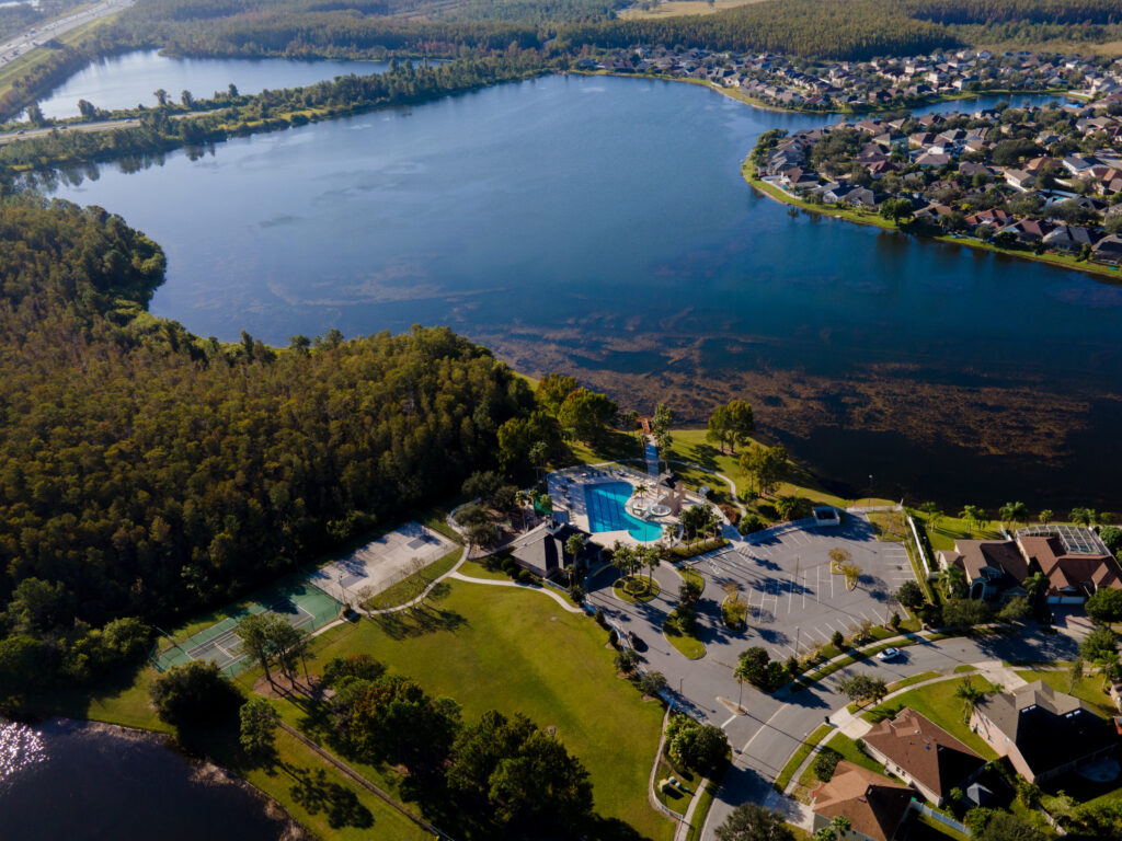 Aerial view of the Falcon Trace amenity area beside a lake